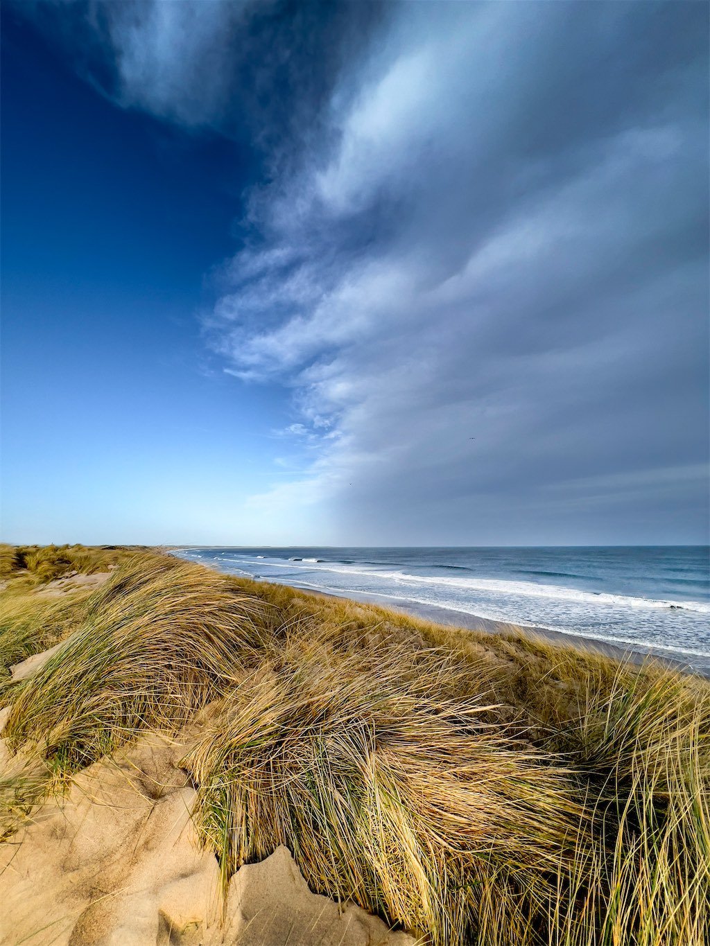 Cresswell Beach over the sand dunes