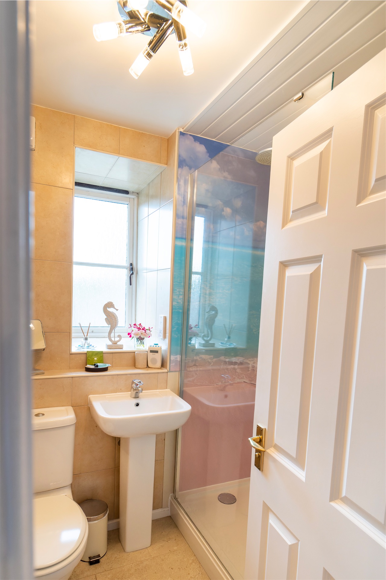 BayView ensuite shower room with walk-in rainfall shower and underfloor heating